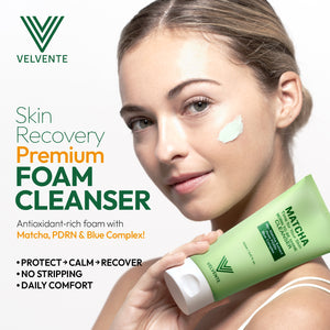 Woman holding a green Velvente foam cleanser with product details for protect calming recover no stripping daily comfort