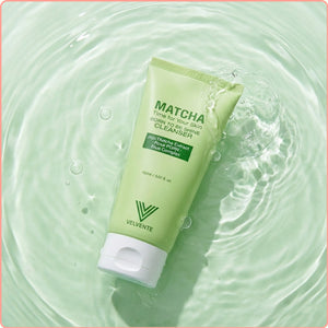 Green tube of Velvente Matcha cleanser on a water surface, foaming face wash